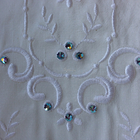  heirloom embroidery on cream silk with delicate eyelets, floral motifs, and fine satin stitches.