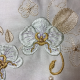 Machine embroidered dimensional orchids