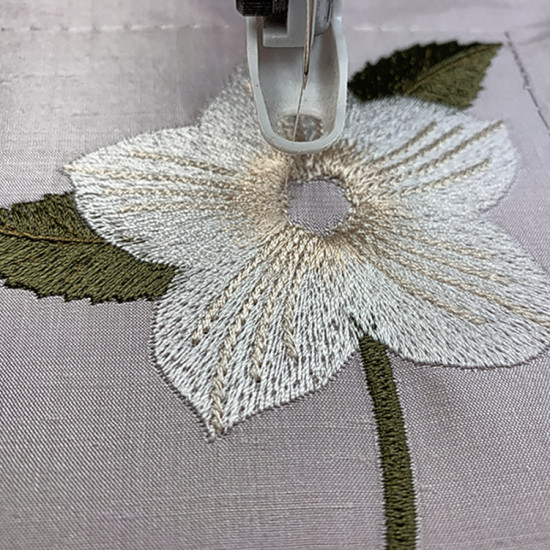 Botanical machine embroidery: hellebores, green leaves, red berries  