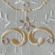  heirloom embroidery on cream silk with delicate eyelets, floral motifs, and fine satin stitches.