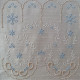  heirloom embroidery on cream silk with delicate eyelets, floral motifs, and fine satin stitches.